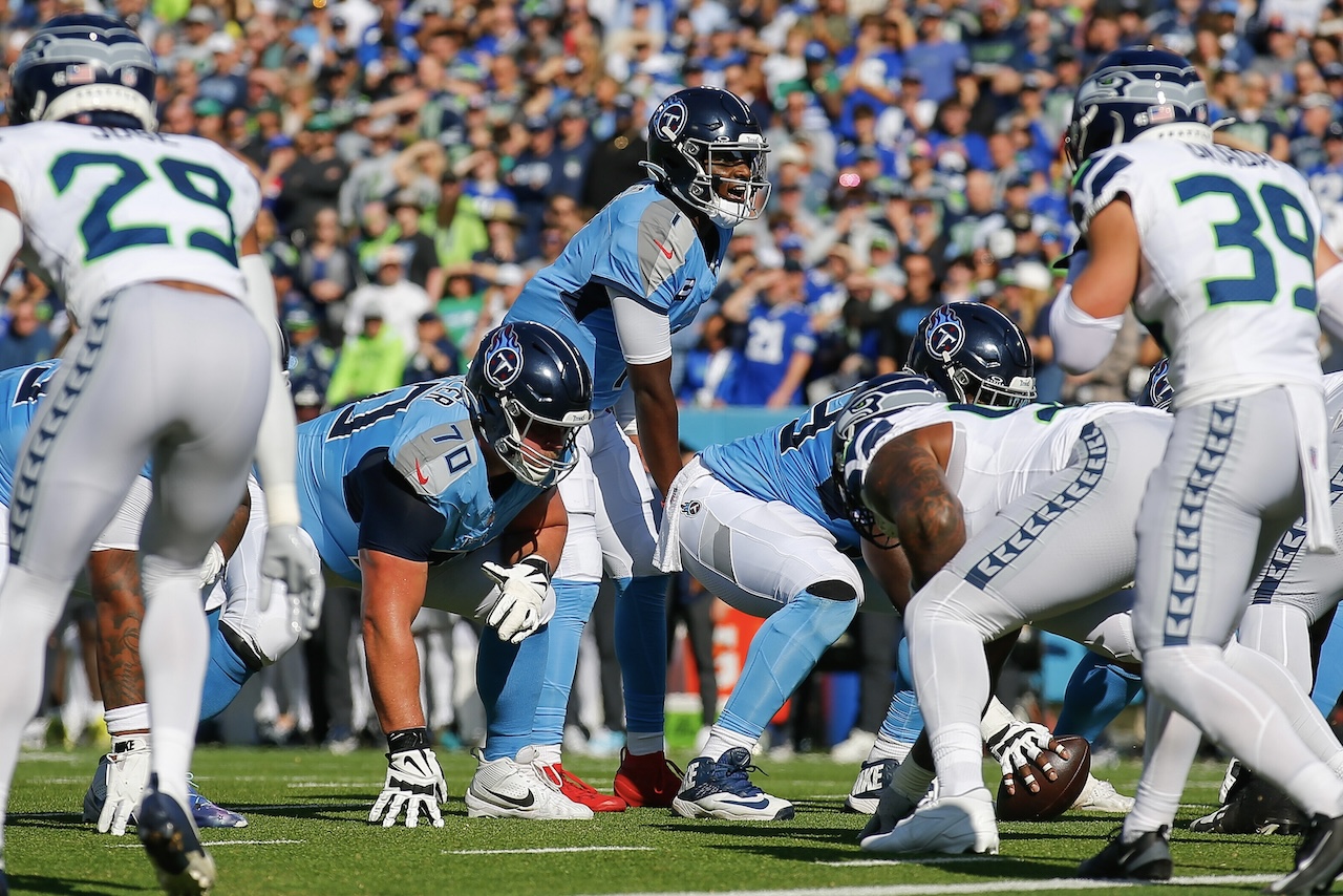 Tennessee Titans quarterback Cam Ward (1) at the line of scrimmage during the first half of an NFL football game against the Seattle Seahawks, Sunday, Nov. 23, 2025, in Nashville, Tenn. (AP Photo/Stew Milne)